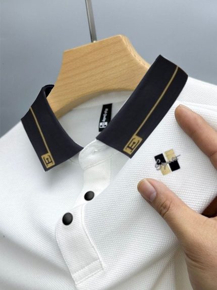 White Polo with Black and Gold Trimmed Collar and Signature Logo